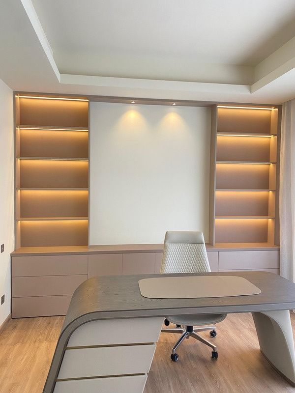 CEO office with backlit timber shelving and executive desk