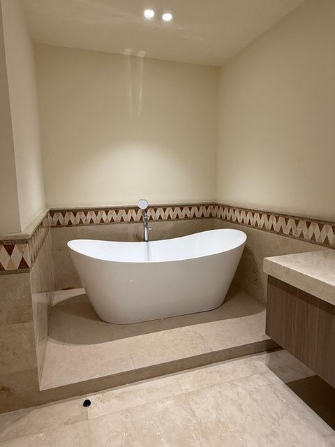 Bathroom with freestanding tub and timber vanity