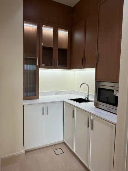 Pantry kitchenette with dark timber upper cabinets